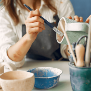 Intellectual Wellness Example: Photo of a person doing pottery
